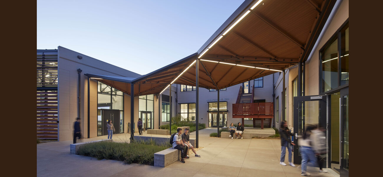 Outdoor patio with a partial roof for shade.