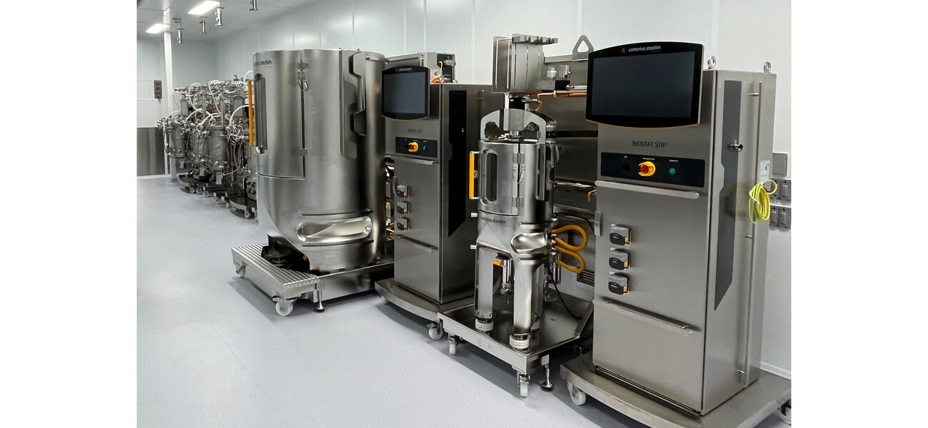 A wall lined with stainless steel lab equipment