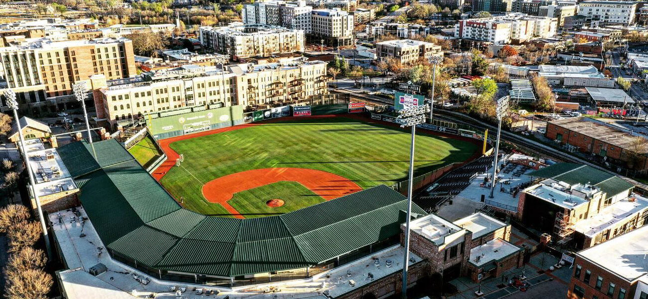 Aerial view of a baseball field and the surrounding buildings